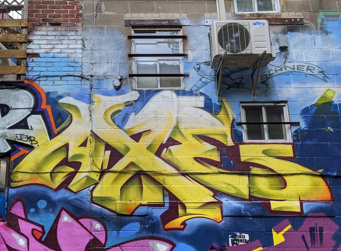 Axe's piece on the tribute to Scaner wall for the 2023 edition of Mural Festival