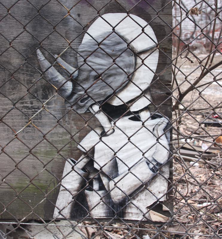 Kat wheatpaste in a Plateau alley