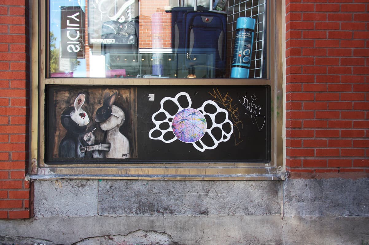 Wheatpastes by Kat (left) and Swarm (right) on Mont-Royal