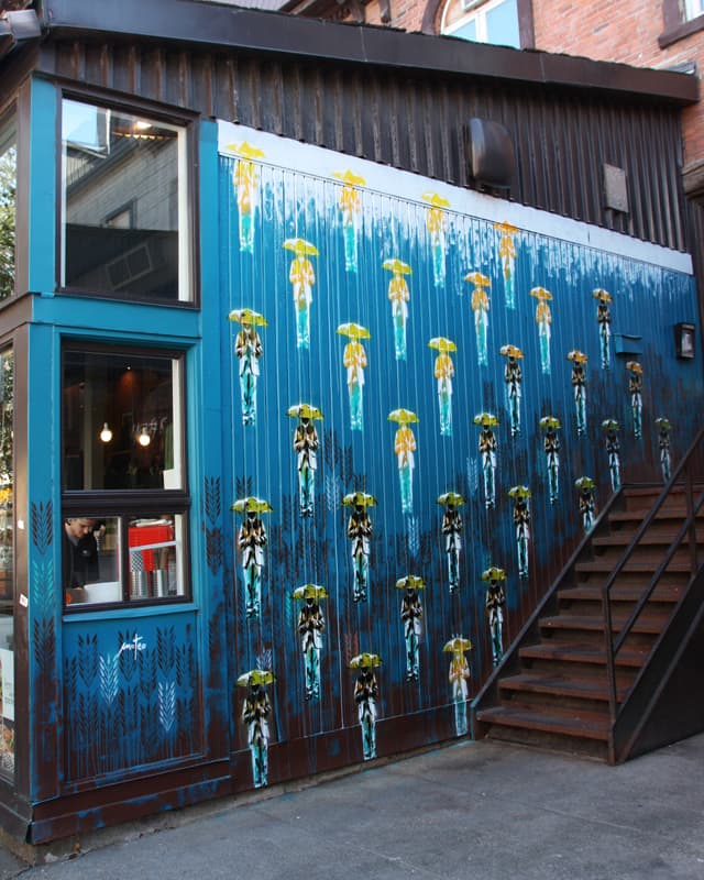 Mateo on restaurant side wall in the Quartier Latin