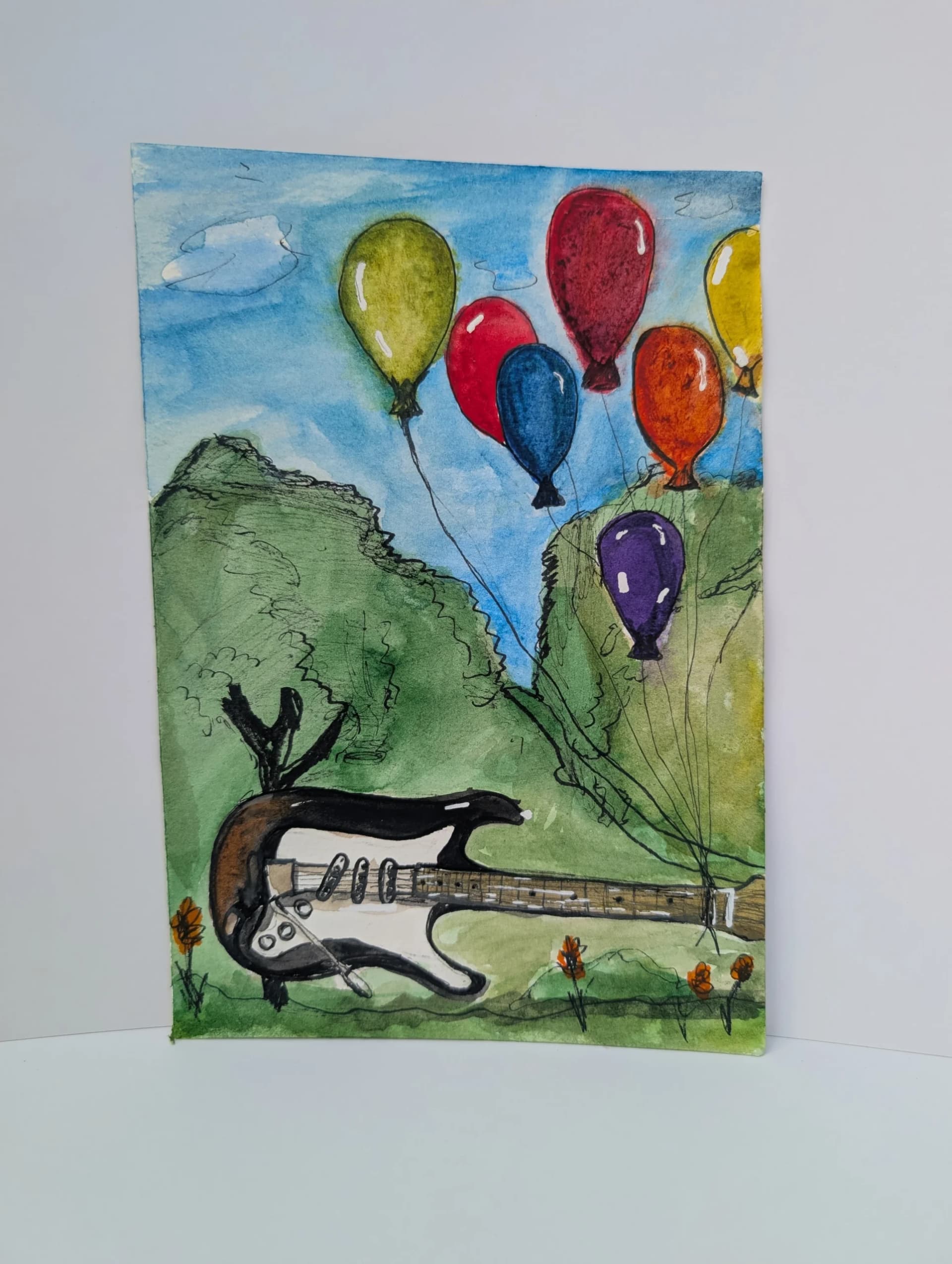 Guitare et ballons colorés