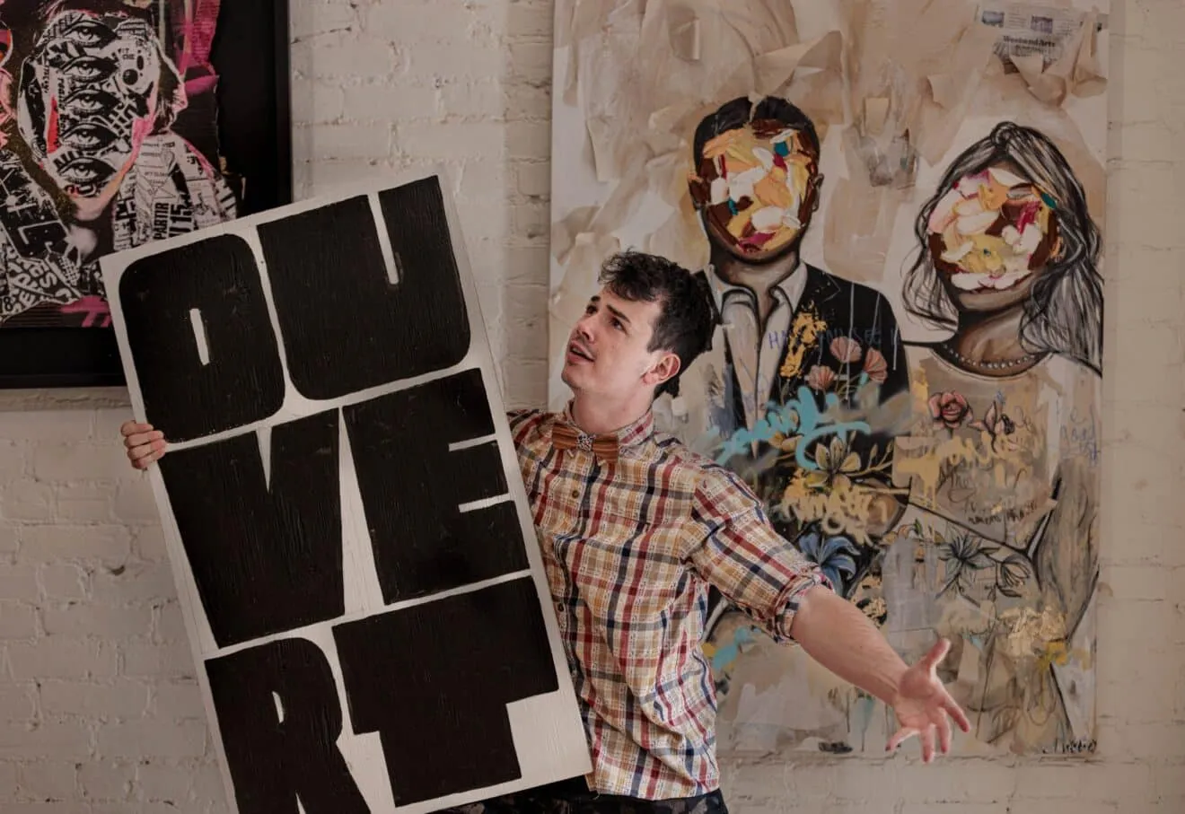 Dorian holding an ouvert board