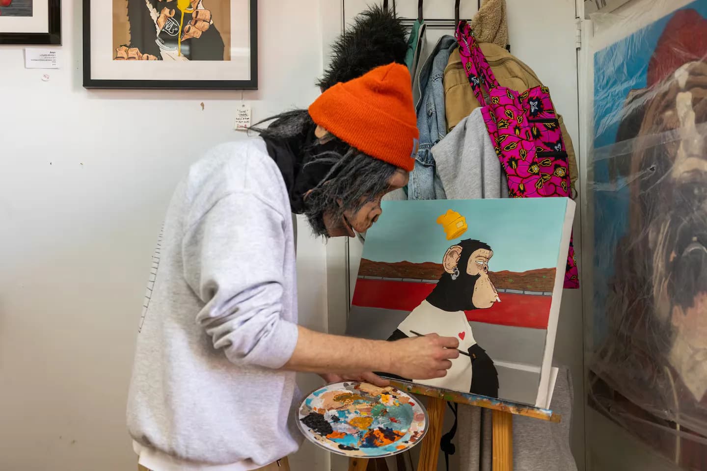 An artist at the easel, during the visit