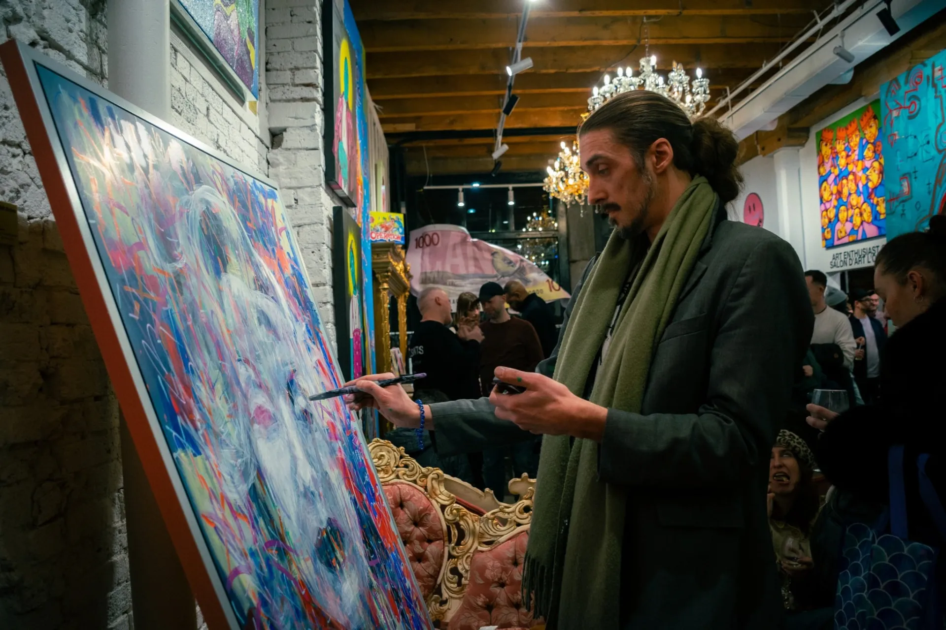 Artist painting in the gallery