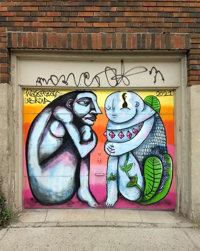 Labrona (left) and Waxhead (right) on a Plateau garage door