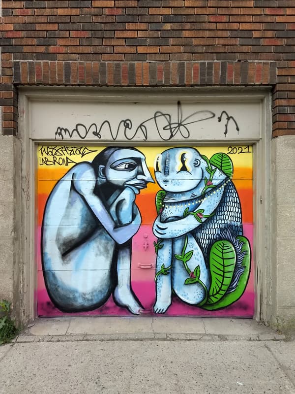 Labrona (left) and Waxhead (right) on a Plateau garage door