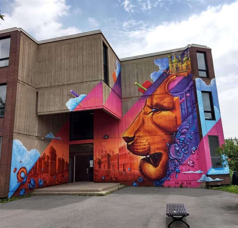 Monk.e in collaboration with Haks and Jimmy baptiste on a South West high school (front view)
