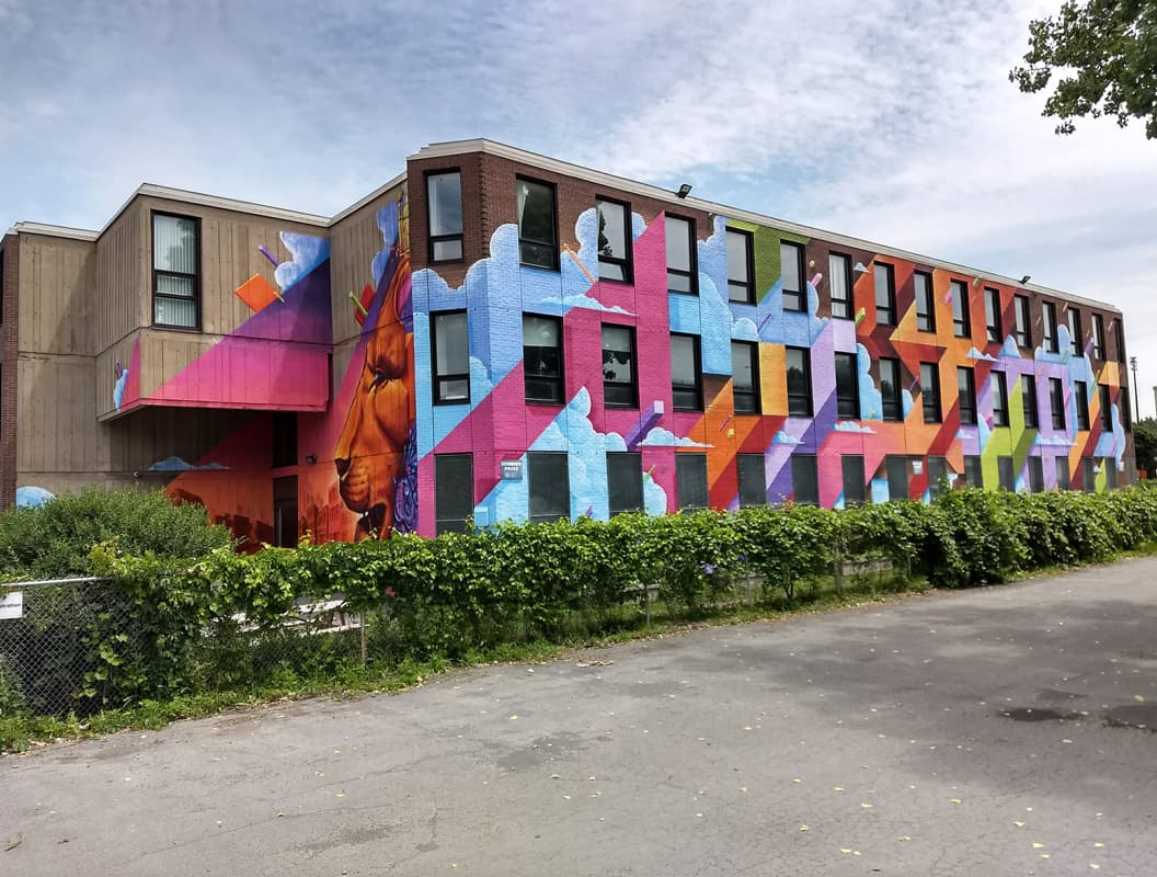 Monk.e in collaboration with Haks and Jimmy baptiste on a South West high school (side view)
