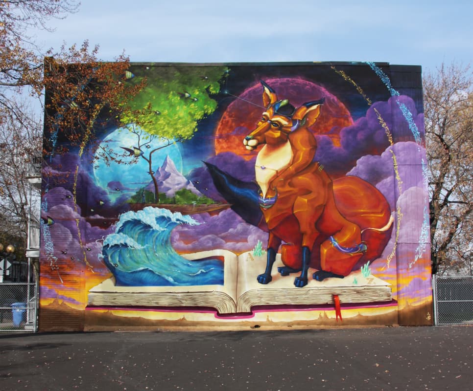 Monk.e mural in a Ville Emard school playground