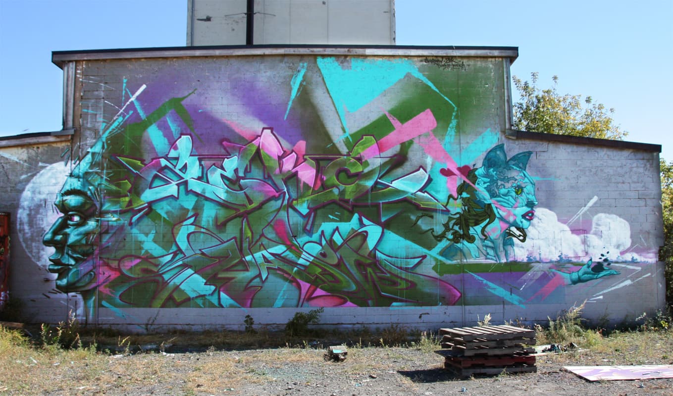 A'Shop wall featuring Shadow (middle ground level), Zek (above, plus background), Monk.e (left) and Ankh One (right)