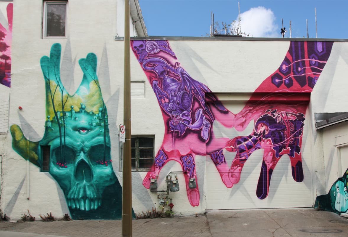Monk.e (left), Strike (middle) and Flying Eric (right) for A'Shop's Hip Hop You Don't Stop project on the walls of a NDG garage