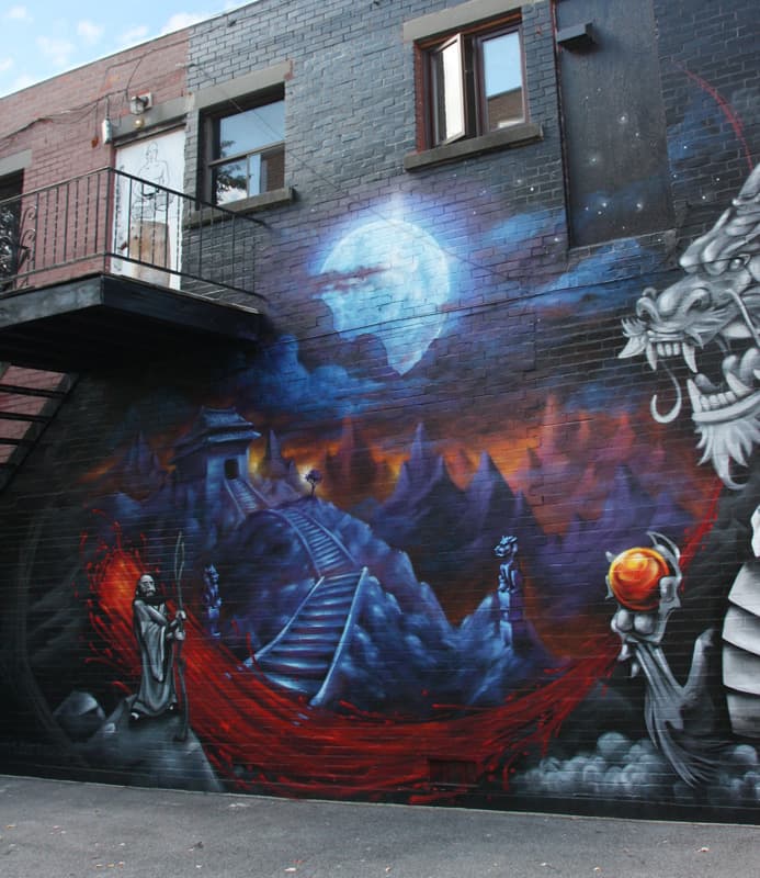 Monk.e's part in a mural collaboration with Axe and Awe in Ahuntsic