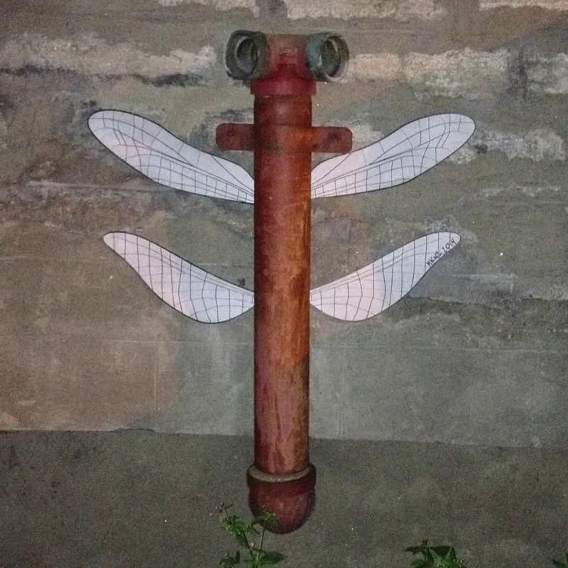 Dragonly wings wheatpaste by Makenoize; photo Makenoize