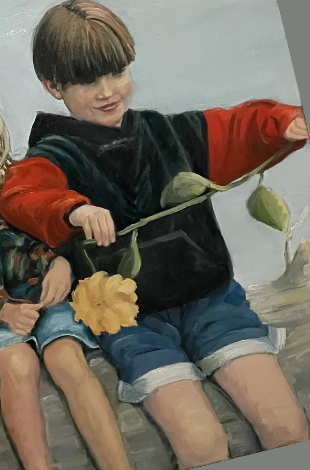 Laughing children with flower