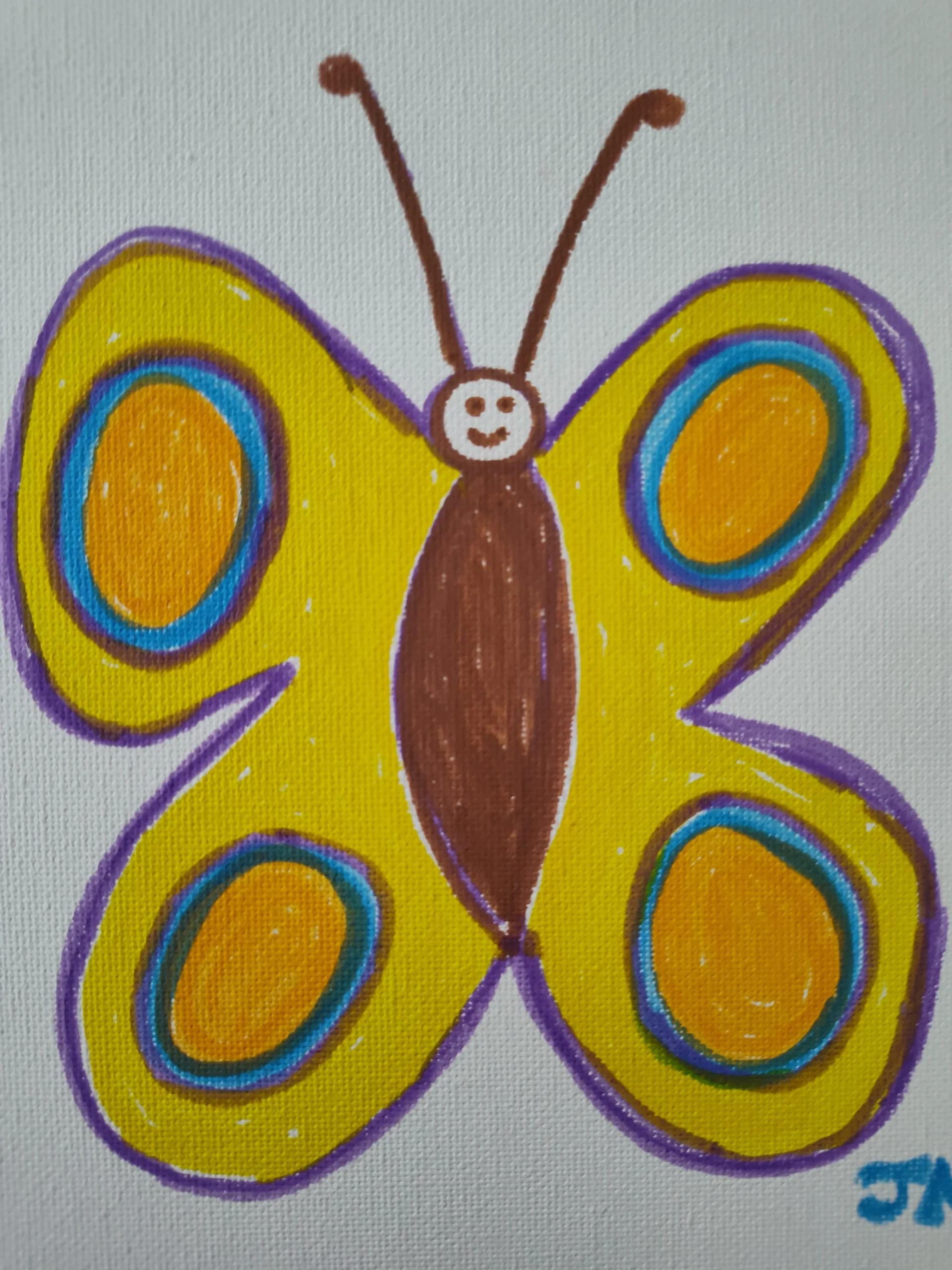 Papillon coloré et souriant